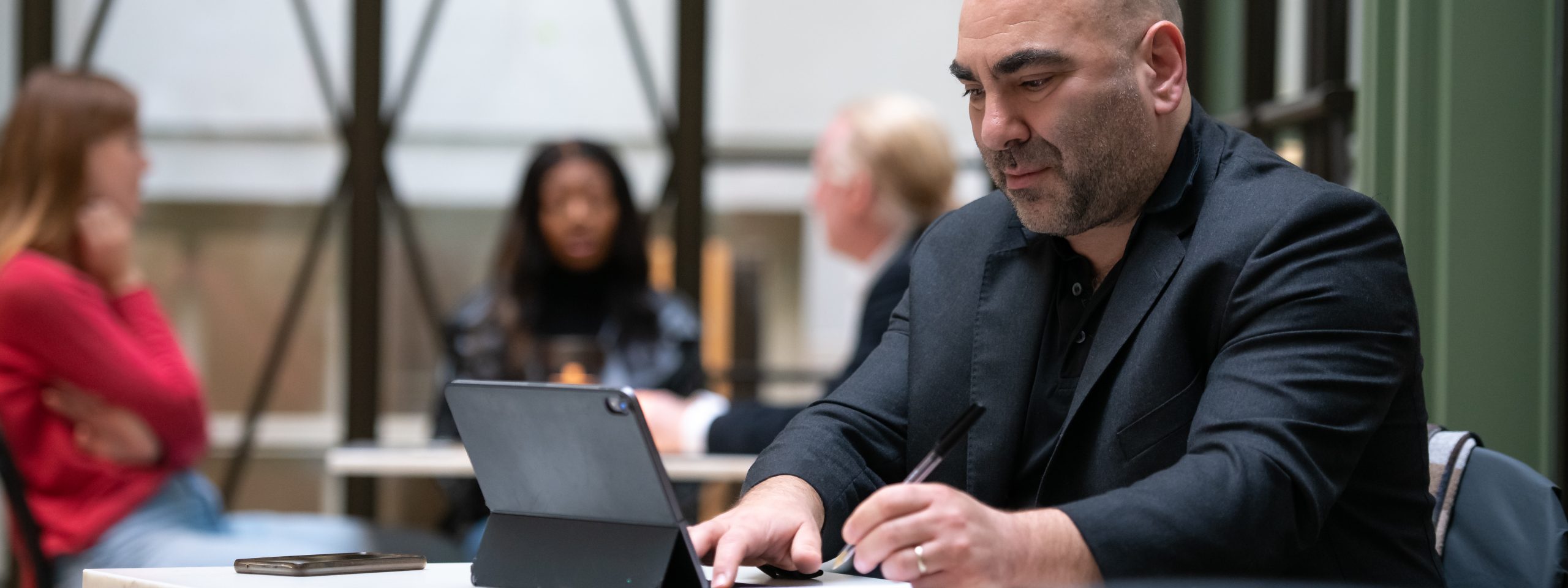 Man looking at tablet